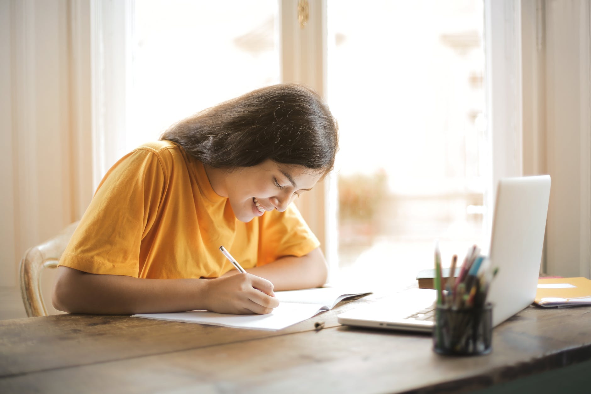 Young person working on her school tasks using Ai for Maths